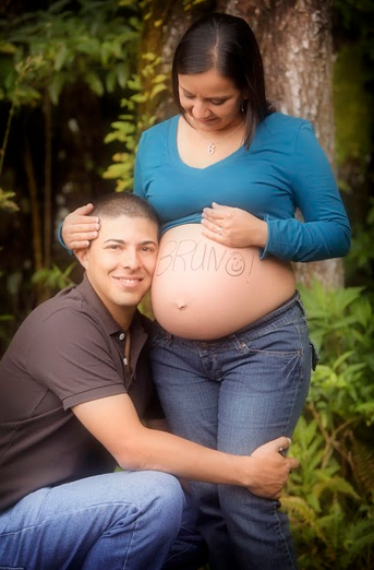 pregnancy picture. pregnant mom with dad and baby name in ink